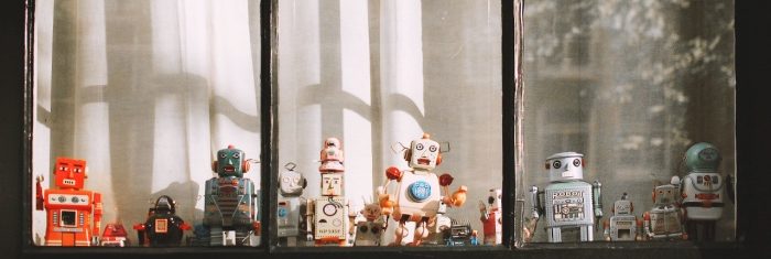 Toy robots behind the window