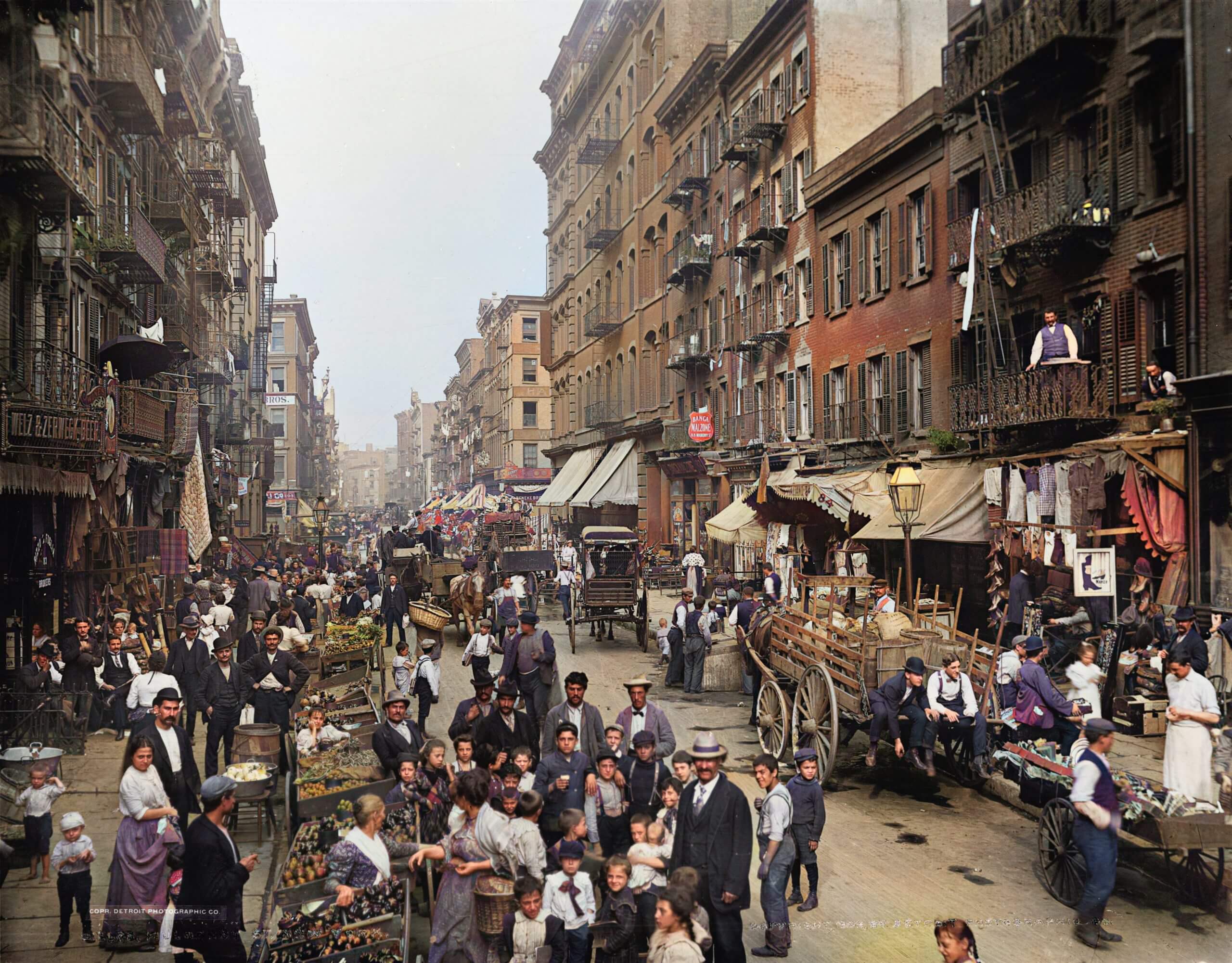 a crowded street in 1900s New York, autocolorized photo