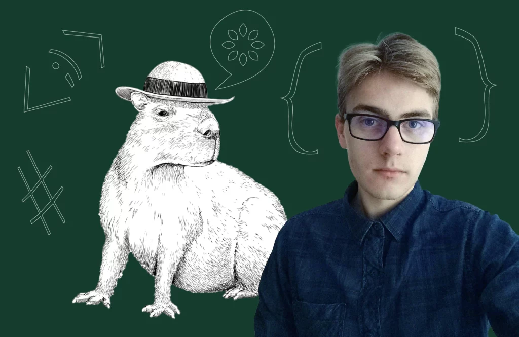A person with short blond hair and glasses is wearing a dark blue shirt and facing the camera. Next to the person, there is a drawing of a capybara wearing a hat, set against a dark green background with various doodles including symbols and curly brackets.