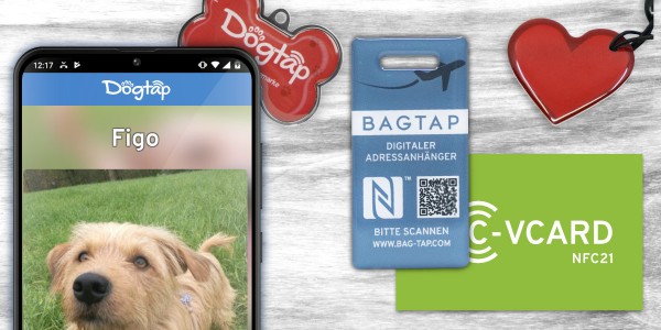 NFC21 product image showing a smartphone with a digital DogTap dog profile, a blue BAGTAG digital address tag, a red heart-shaped tag, and a green NFC21 C-VCARD on a wooden background.