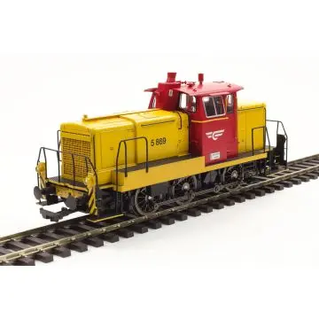 Yellow and red diesel locomotive model displayed on railway tracks