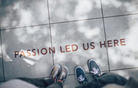 Inscription on the sidewalk - 'Passion led us here'